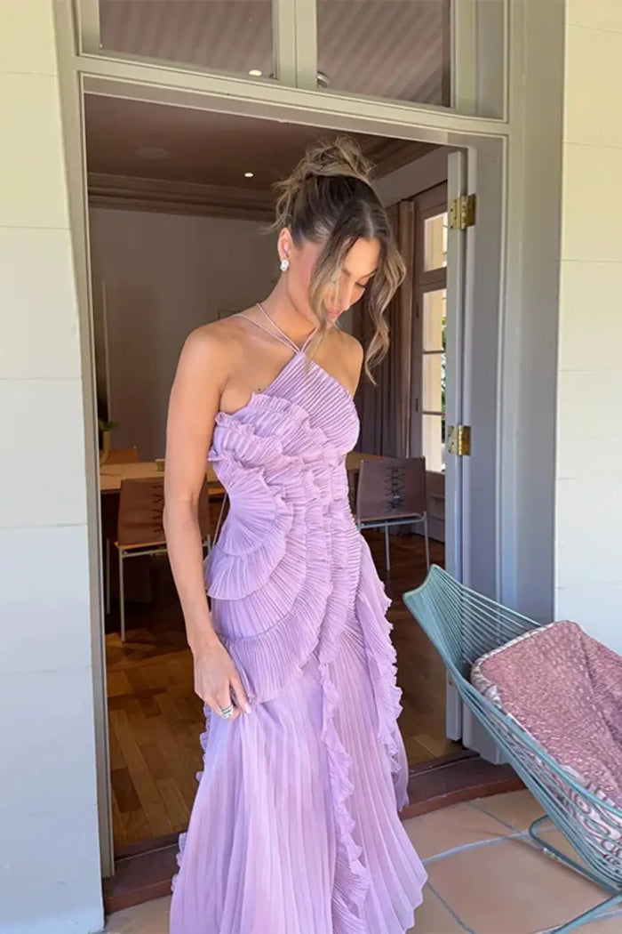 Women’s pleated fabric maxi dress with layered ruffle halter neckline, stylish and flowing for elegant summer wear.