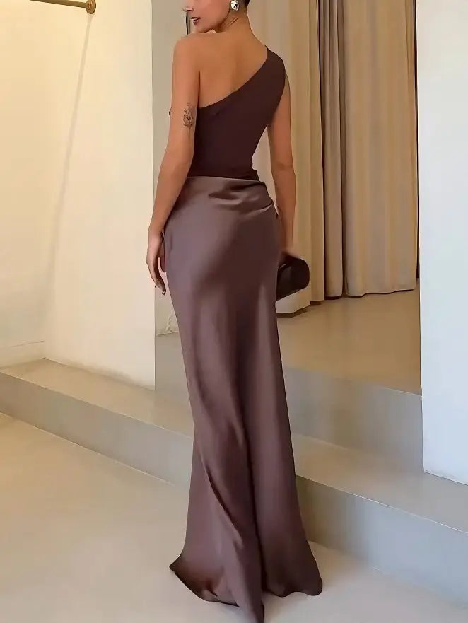 Women's pleated maxi dress with an asymmetric one-shoulder design, elegant summer gown in flowing fabric.