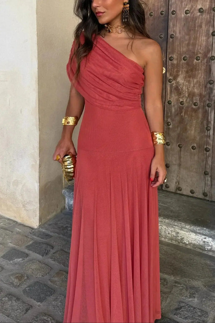 Women's pleated polyester maxi dress with flowing asymmetrical design, perfect for summer evening occasions.