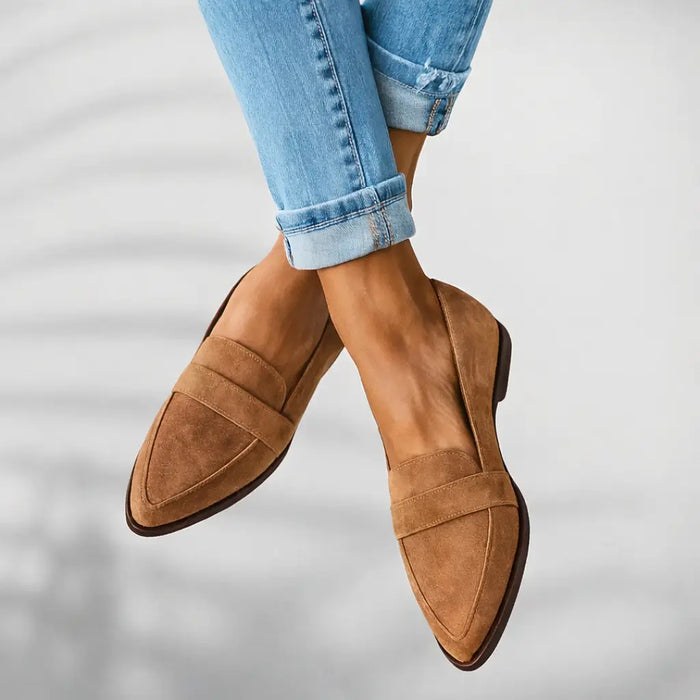 Women's polished leather loafers with a sleek toe design, slip-on style, perfect for elegant and comfortable everyday wear.