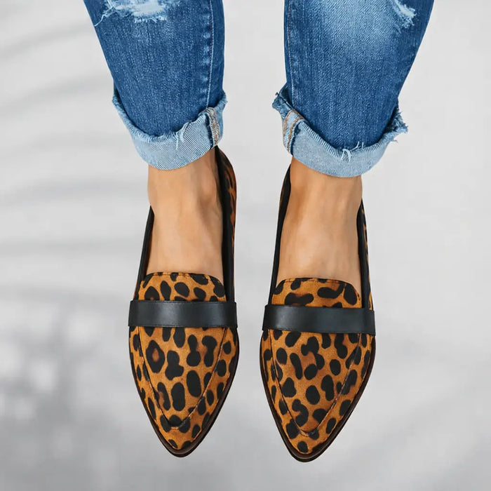 Women's polished leather loafers with sleek toe slip-on design, stylish and comfortable for everyday wear.