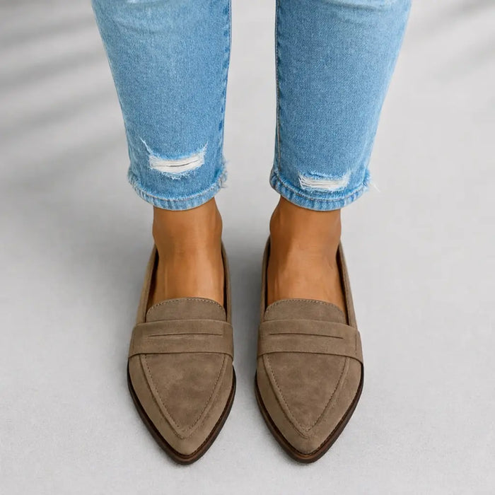 Women's polished leather loafers with sleek toe design, slip-on style, perfect for elegant casual or professional wear.
