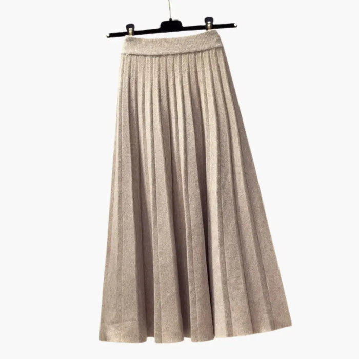 Women’s ribbed knit pleated maxi skirt with flowing ankle-length design and elegant textured fabric, perfect for stylish casual wear.