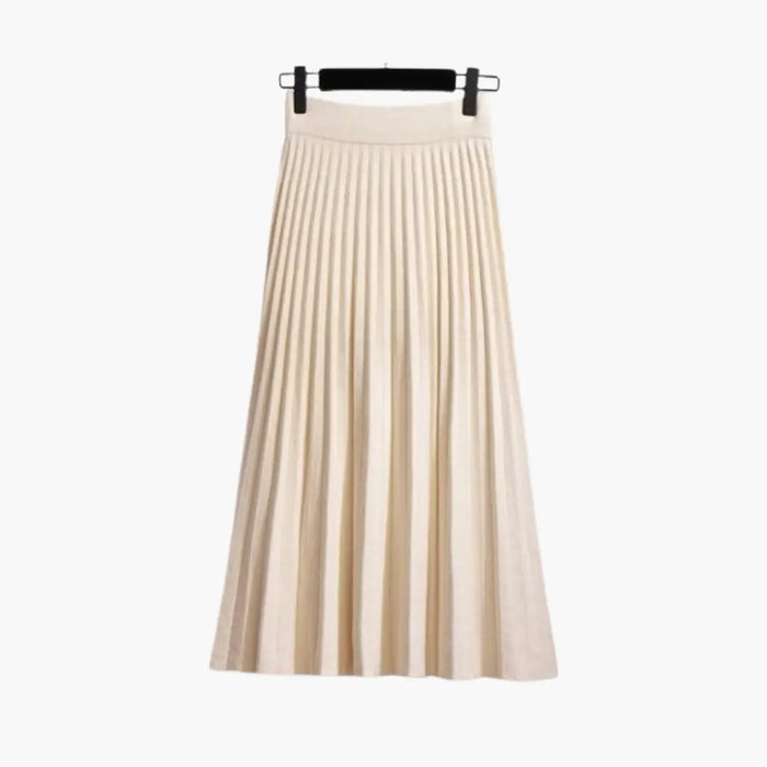 Women's ribbed knit pleated maxi skirt from LondonLaneStore, flowing ankle-length design with elegant textured fabric.