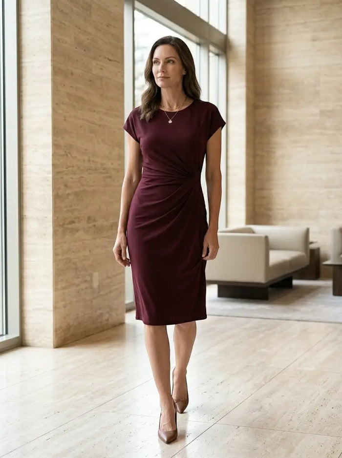 Women's rich fabric bodycon midi dress with elegant sculpted wrap design, perfect for formal occasions.