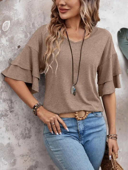 Women's sheer white blouse with elegant half sleeves, perfect for summer; stylish blouse from LondonLaneStore.