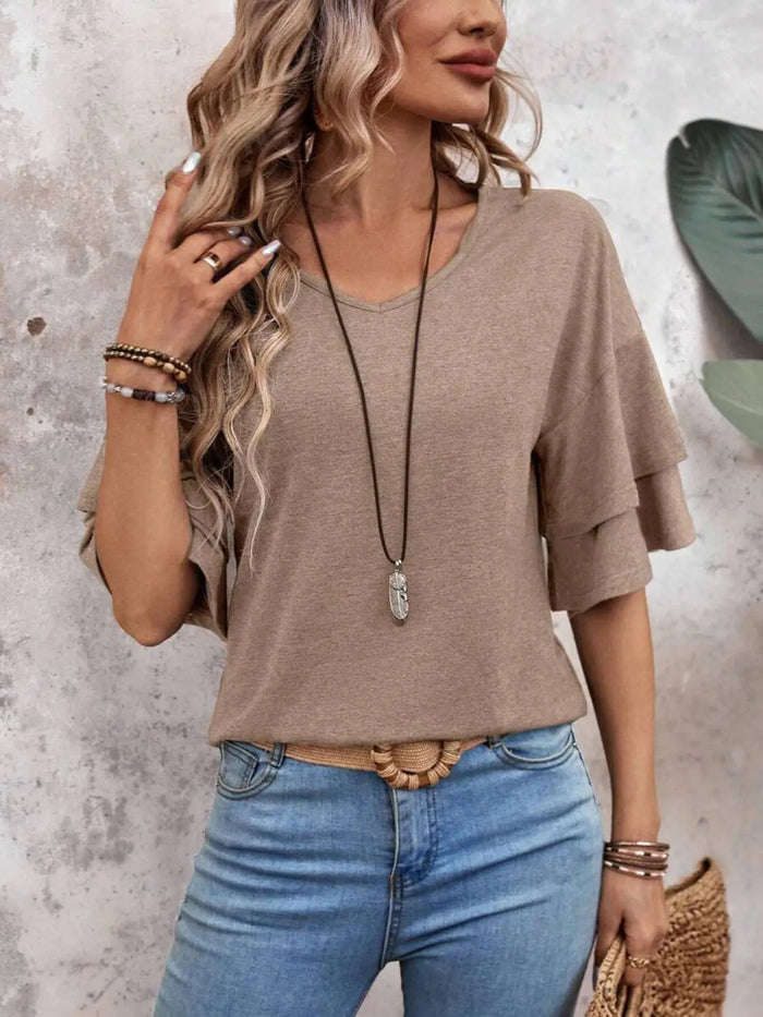 Women’s sheer white blouse with half sleeves, elegant summer top from LondonLaneStore, showcasing lightweight, breathable fabric.