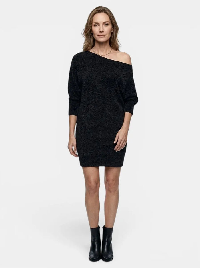 Women's shimmering sequined mini dress with long sleeves and relaxed fit, designed for cocktail or party occasions.