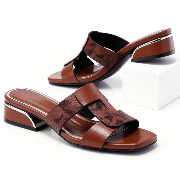 Women’s smooth leather T-strap sandals with snake print design, stylish casual footwear perfect for comfortable, fashionable wear.