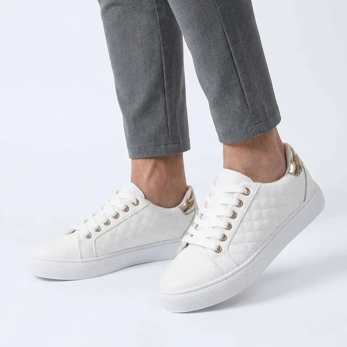 Women's white quilted lace-up sneakers by LondonLaneStore, stylish low-top casual shoes with a smooth finish and comfortable fit.