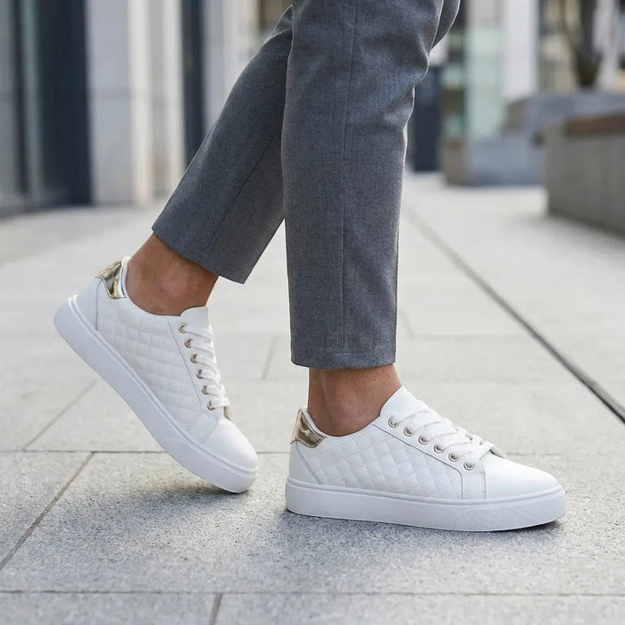 Women's quilted lace-up sneakers by LondonLaneStore, stylish white low-top casual shoes with smooth quilted detail.