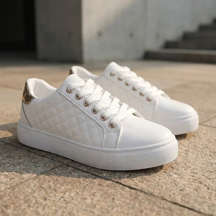 Women's quilted lace-up sneakers by LondonLaneStore, stylish white low-top casual shoes with smooth quilted design.