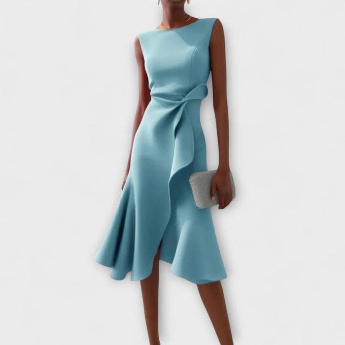 Soft draped midi dress with asymmetric hem, worn by a woman in a summer setting, showcasing elegant women's dress design.