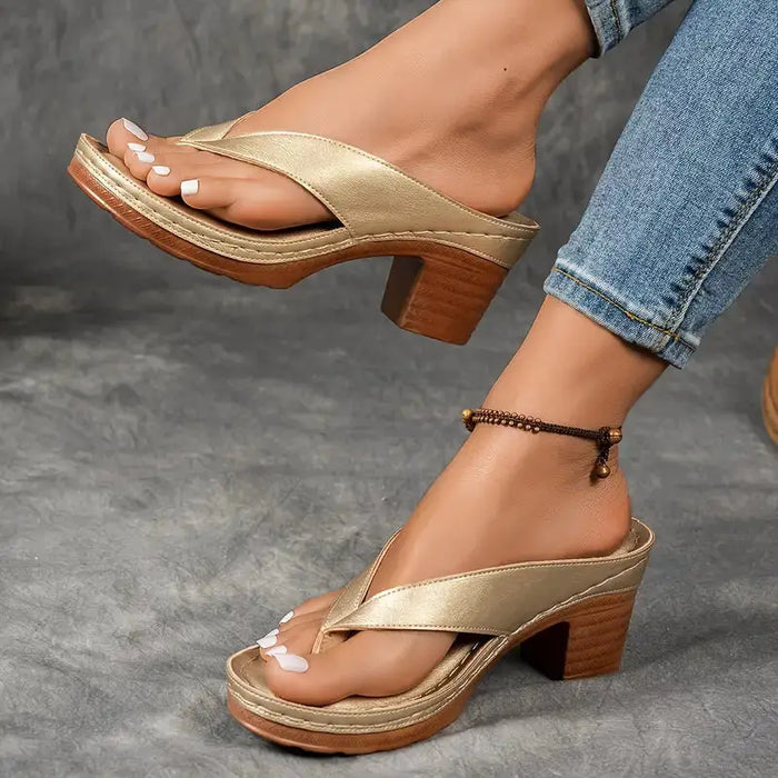 Women’s orthopedic slippers made of soft fabric featuring cushioned support for comfortable indoor footwear.