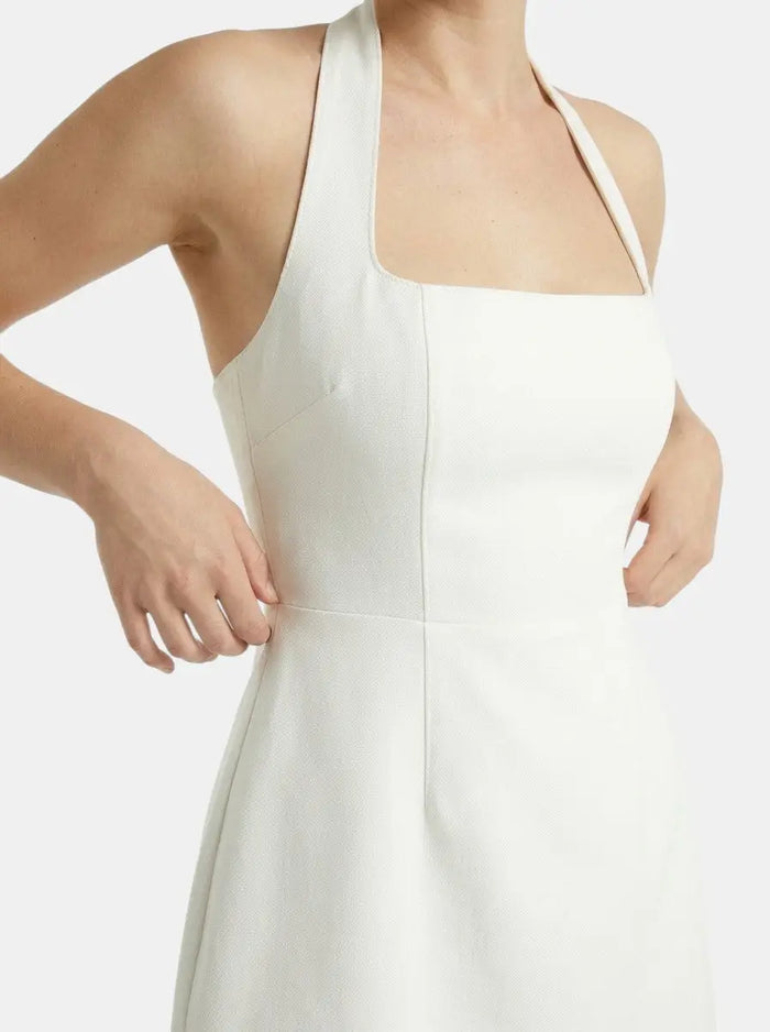 Women's soft woven halter mini dress by LondonLaneStore, elegant A-line summer cocktail dress with a fitted bodice and flowing skirt.