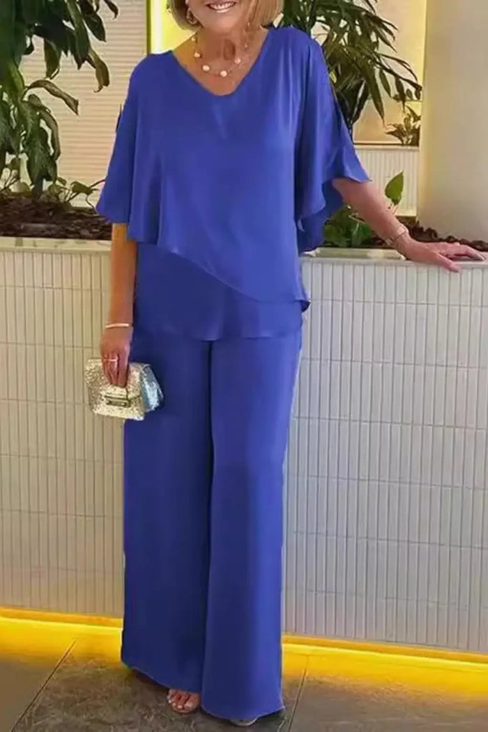 Women’s cobalt blue loungewear set with relaxed batwing top and wide-leg trousers, stylish and comfortable women's suit.