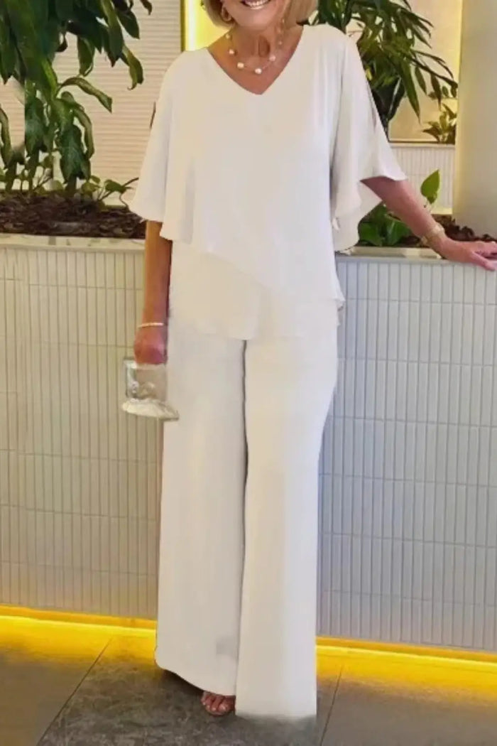 Women’s cobalt blue loungewear set with relaxed batwing top and wide-leg trousers, casual and comfortable women's suit.