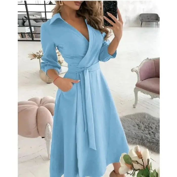 Women's structured fabric blazer dress with tailored fit and belted design, featuring elegant details and a polished look.
