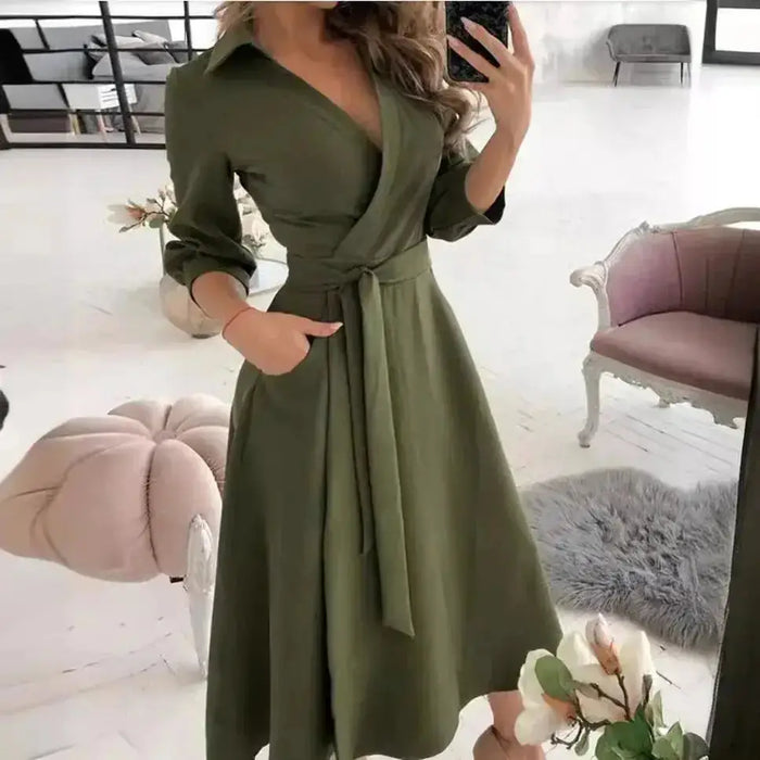 Women's structured fabric blazer dress with tailored fit and belt, featuring an elegant design perfect for stylish occasions.