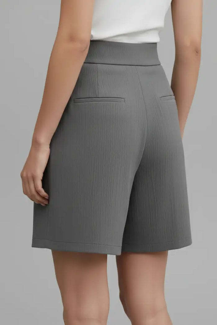 Stylish women's high-waist shorts with a structured fit and modern relaxed style, perfect for summer wear.