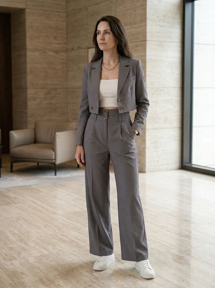 Women's structured pant suit with tailored cropped blazer and high-waist wide-leg trousers, stylish and professional women's set.