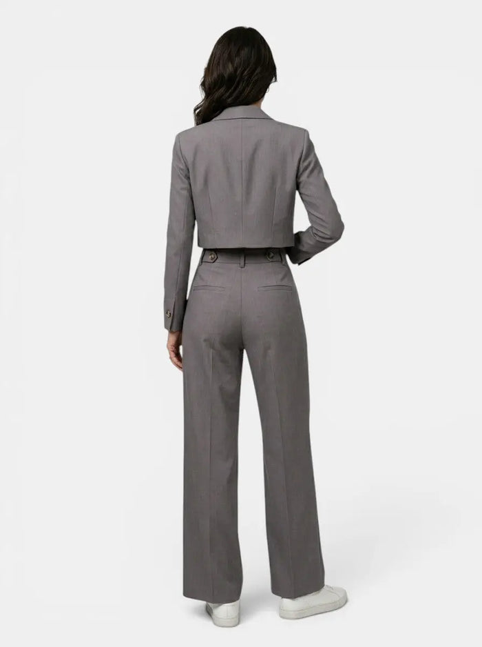 Women's structured pant suit featuring a tailored cropped blazer and high-waist wide-leg trousers, stylish and professional.