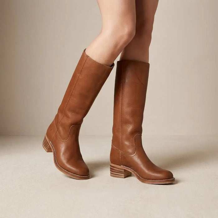 Women's synthetic leather knee-high boots with sleek round toe and stacked heel, featuring a comfortable fit and stylish design.