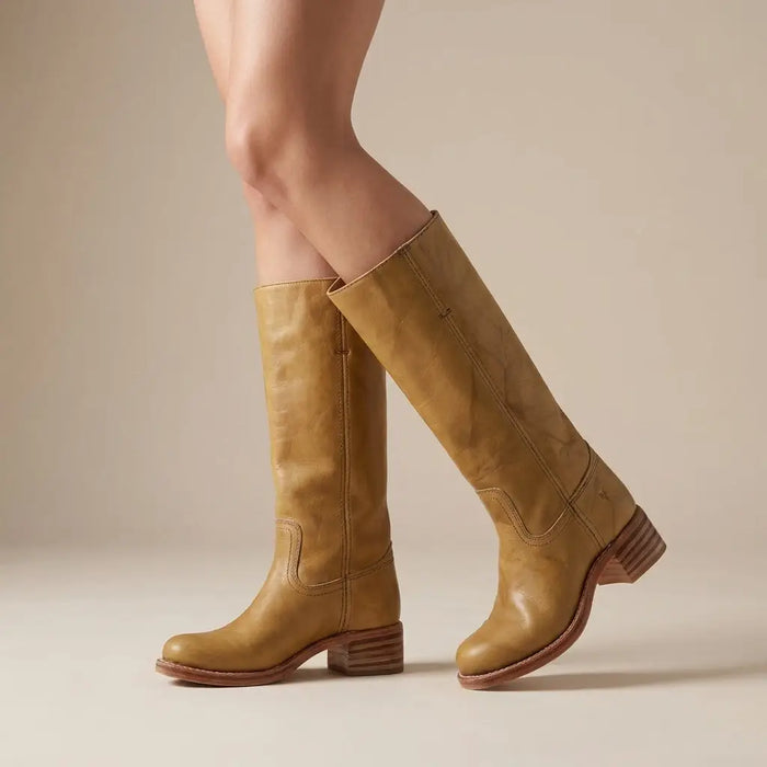 Women's synthetic leather knee-high boots with sleek round toe and stacked heel, offering stylish comfort and a modern look.