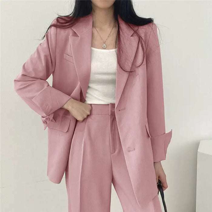 Women’s tailored blazer suit set with structured blazer and wide-leg trousers, stylish and elegant for professional wear.