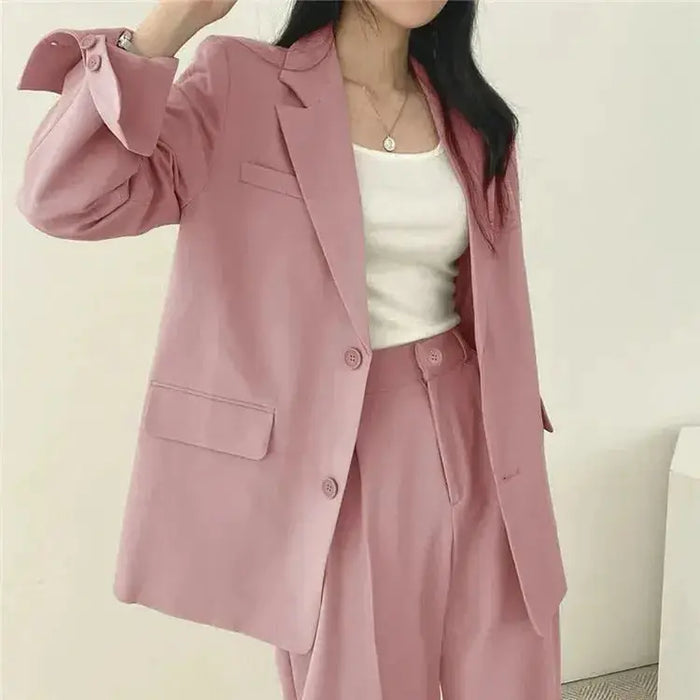 Women's tailored blazer and wide-leg trousers suit set by LondonLaneStore, featuring a structured blazer and matching trousers.