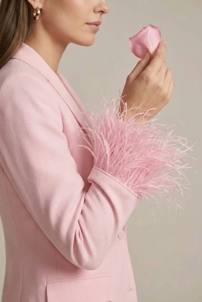 Women’s tailored blazer with feather cuffs and elegant straight-leg trousers, perfect for sophisticated all-season outfits.