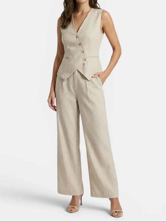 Women's tailored fabric suit set featuring an elegant sleeveless blazer and wide-leg trousers, stylish and professional.