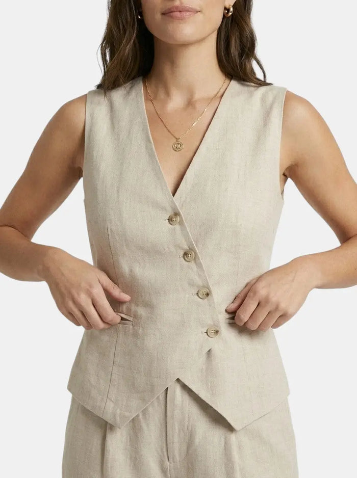 Elegant women's tailored fabric suit set featuring a sleeveless blazer and wide-leg trousers, perfect for professional or formal wear.