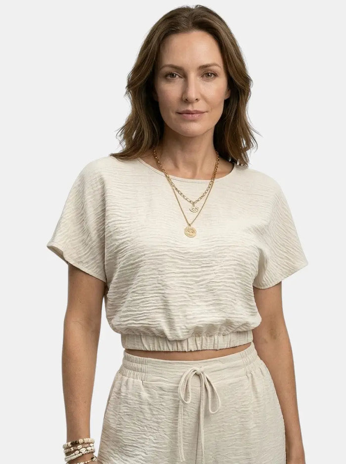 Women's textured cotton loungewear set with relaxed crop top and wide-leg trousers, casual and comfortable for everyday wear