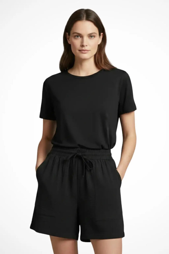 Women's textured fabric casual shorts with drawstring waist and pockets, featuring a relaxed fit and comfortable design.