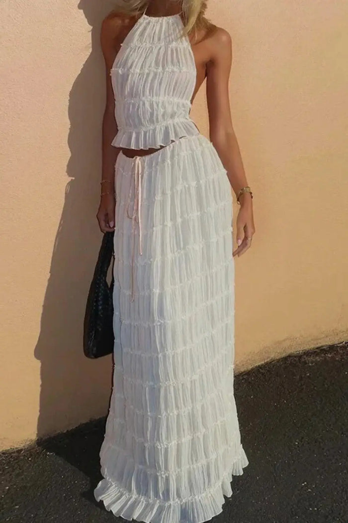 Women’s textured ruched maxi skirt set with stylish halter top, two-piece summer outfit, featuring a comfortable fit and trendy design.