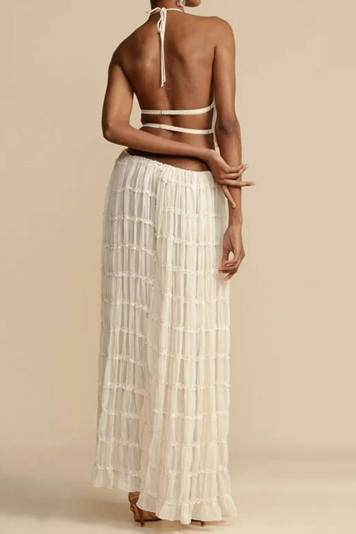 Women’s textured ruched maxi skirt set with stylish halter top, two-piece summer outfit, featuring a chic, textured fabric and modern design.