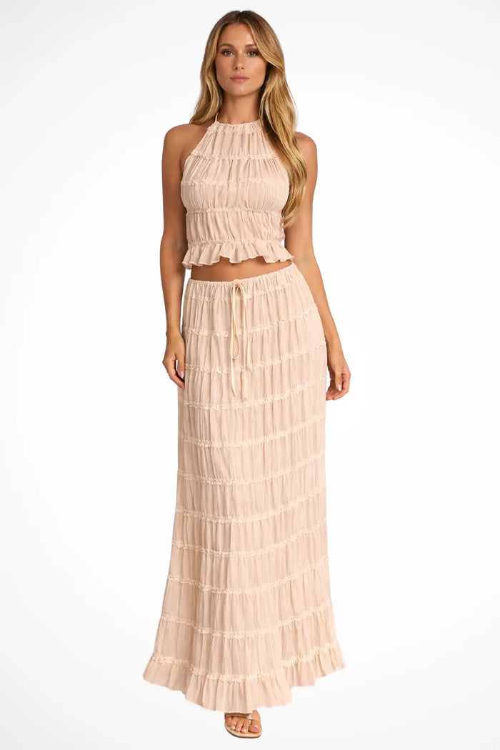 Women's textured ruched maxi skirt set with stylish halter top, two-piece summer outfit, featuring a fashionable and comfortable design.