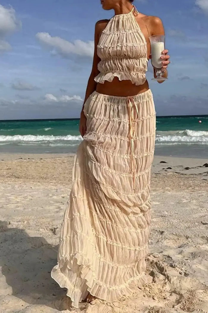 Women's textured ruched maxi skirt set with stylish halter top from LondonLaneStore, perfect for summer two-piece outfit.