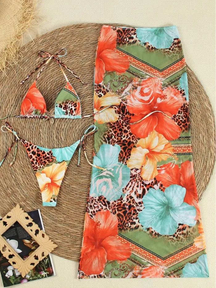 Women’s tropical floral 3-piece bikini set with adjustable swimwear, mesh skirt, perfect for stylish beach outings.