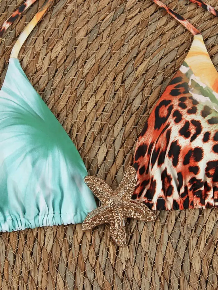 Women's tropical floral 3-piece bikini set with adjustable swimwear and mesh skirt, stylish beach outfit perfect for summer.