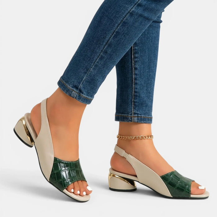 Women's two-tone leather sandals with open-toe slingback design, stylish and comfortable for warm weather.