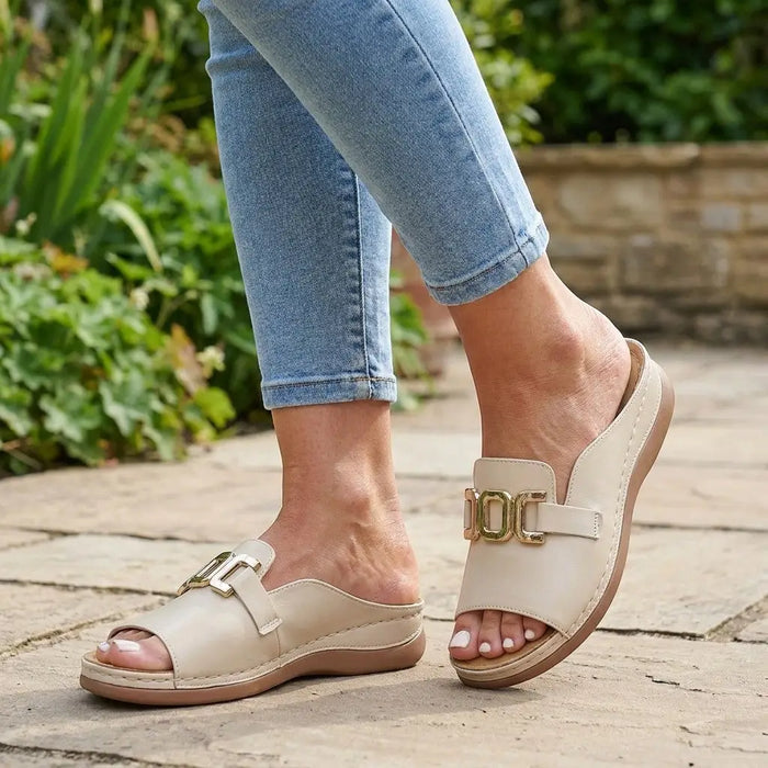 Women's vegan leather orthopedic sandals with chic wedge heels and comfortable footbed, featuring stylish straps and supportive design.