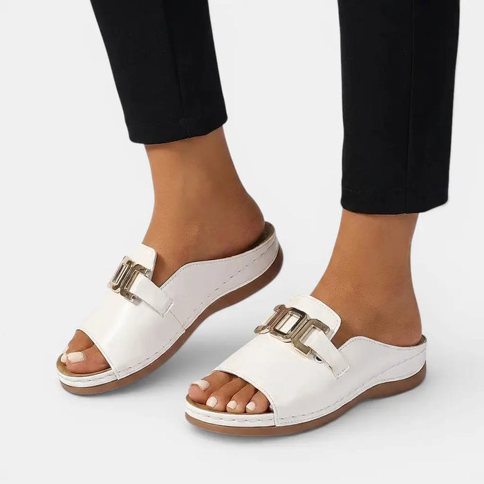 Women's vegan leather orthopedic sandals with chic wedge heels and cushioned soles, designed for comfort and style.
