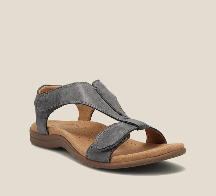 Women’s vegan leather T-strap sandals featuring comfortable summer footwear design, stylish and perfect for warm-weather wear.