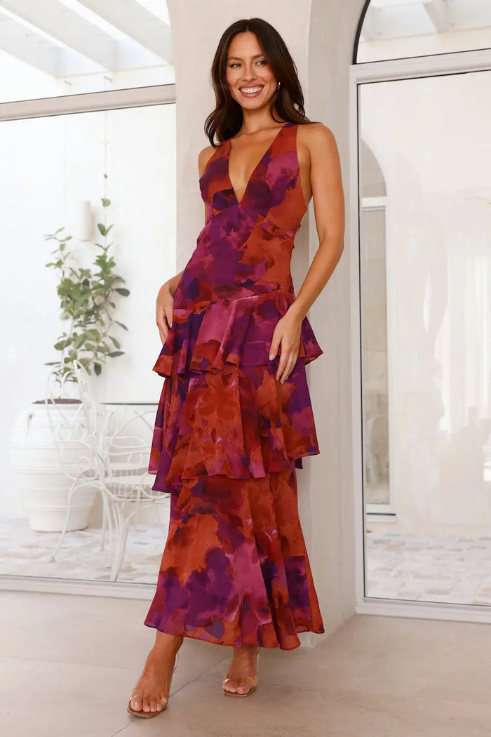 Women wearing a flowing viscose maxi dress with tiered design and graceful movement, perfect for summer occasions.
