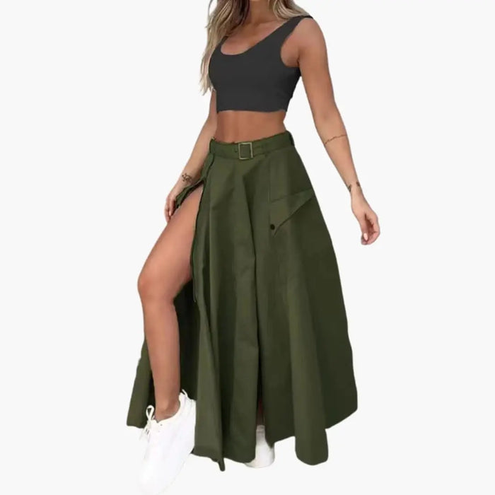 Women's woven maxi skirt with high slit and side pockets, elegant design, featuring flowing fabric and stylish details.