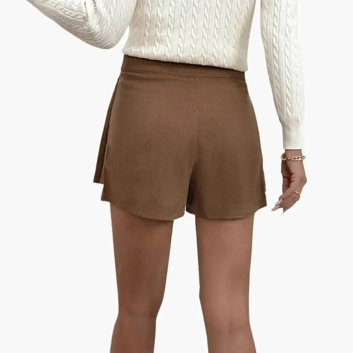 Women’s woven pleated midi skirt with a flowing design and elastic waistband, featuring a structured, elegant look.